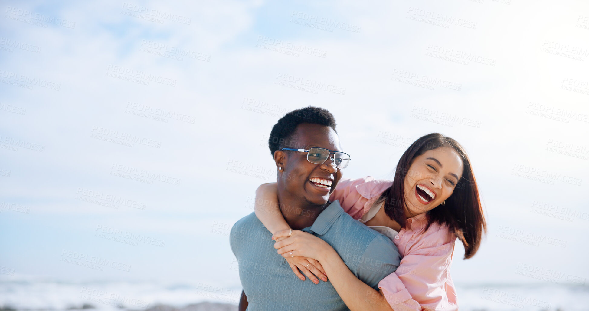 Buy stock photo Love, hug and summer with interracial couple at beach for travel destination, smile and honeymoon vacation. Relax, tropical and adventure with man and woman on date for holiday, bonding and romance