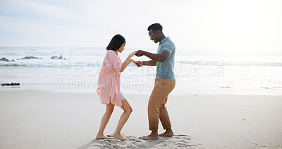 Buy stock photo Love, dance and summer with interracial couple at beach for travel destination, smile and honeymoon vacation. Relax, tropical and adventure with man and woman on date for holiday, bonding and romance