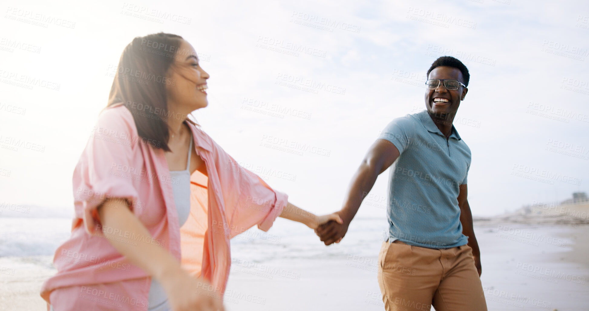 Buy stock photo Happy, holding hands and walk with interracial couple at beach for travel destination, summer or honeymoon vacation. Relax, tropical and adventure with man and woman for holiday, bonding or romance