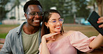 Happy, selfie and couple on bench in park with fun memory, social media post and interracial relationship. Love, photography and man with woman smile on romantic date with outdoor bonding together