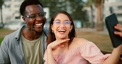 Buy stock photo Laughing, selfie and couple on bench in park with fun memory, social media post and interracial relationship. Love, photography and happy man with woman on romantic date with outdoor bonding together