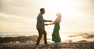 Buy stock photo Couple, dance and beach for holiday, love and bonding together with happiness, energy and romance. Interracial, seaside and man with woman, movement and relationship with getaway trip and sunset