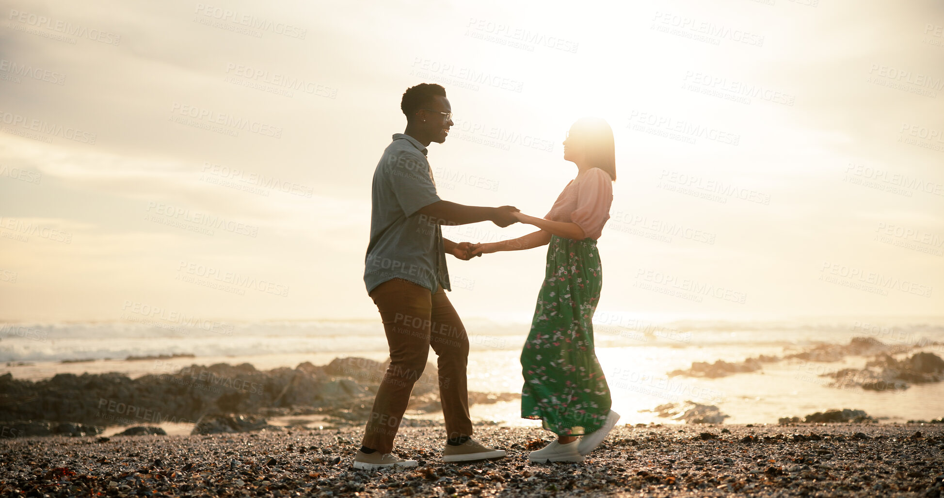 Buy stock photo Couple, dance and beach for holiday, love and bonding together with happiness, energy and romance. Interracial, seaside and man with woman, movement and relationship with getaway trip and sunset