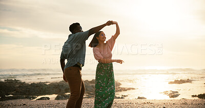 Buy stock photo Couple, sunset and dance on beach for love, summer vacation and holiday for celebration. Man, woman and holding hands at seaside for movement, engagement and commitment in relationship in Mauritius