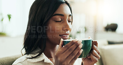 Buy stock photo Coffee, relax and scent with Indian woman on sofa in living room of home for break or caffeine. Aroma, brew and fresh with happy person smelling beverage in mug for afternoon or morning wellness