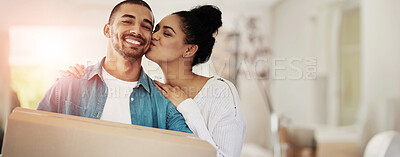 Buy stock photo Portrait of a happy young couple carrying cardboard boxes into their new home