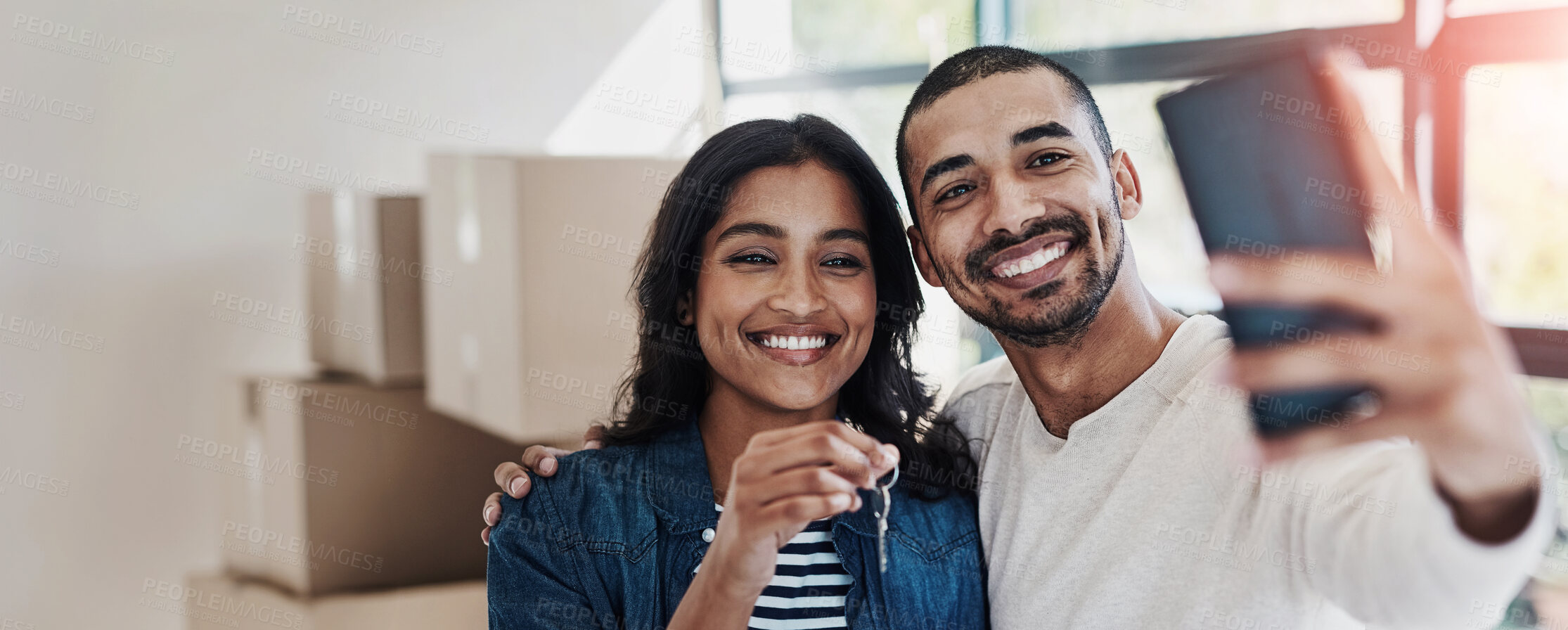 Buy stock photo Selfie, house key and couple moving to new home together with cardboard boxes for real estate. Happy, love and young man and woman with photography picture for apartment or property ownership.