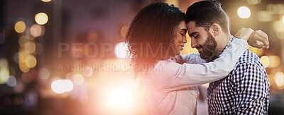 Buy stock photo Shot of an affectionate young couple out on a date in the city