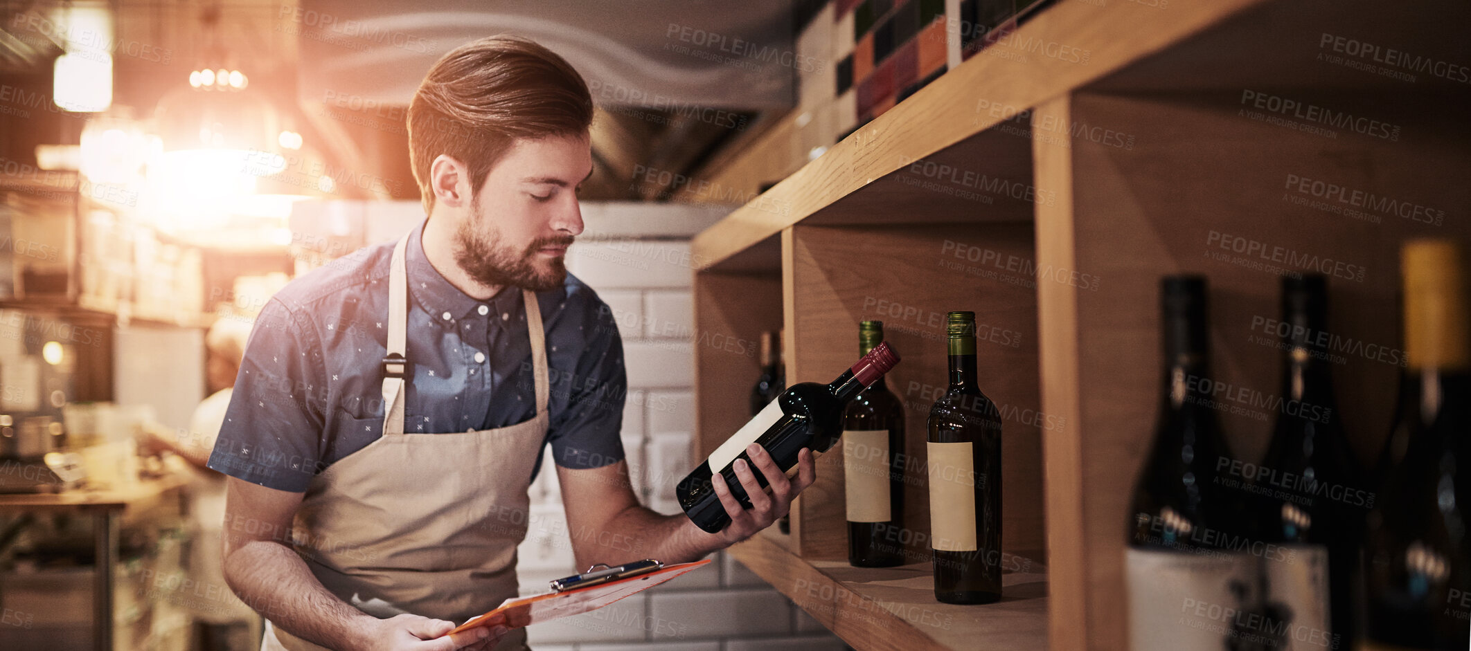 Buy stock photo Shot of a young business owner counting his merchandise