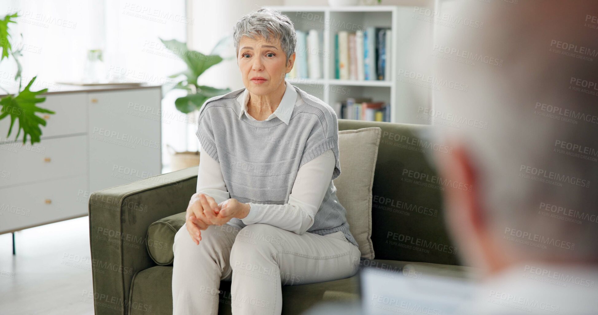 Buy stock photo Psychology, therapist and mature woman on couch for counseling, help or discussion in anxiety. Mental health, support or person on sofa with psychologist for consultation, trauma or stress management