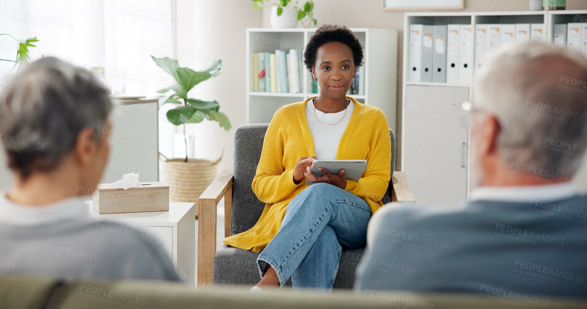 Buy stock photo Therapy, tablet and black woman with couple on sofa for advice, consulting and counseling session. Psychology, talking and people on couch for marriage, relationship and discussion for reconciliation