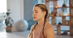 Meditation, yoga and breathing with woman in studio for health, zen and spiritual wellness. Balance, mindfulness and healing aura with person and Kundalini practice for relax, awareness and energy