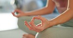 Meditation, yoga and zen with hands of woman in studio for health, peace and spiritual wellness. Balance, mindfulness and healing aura with person and practice for relax, awareness and energy