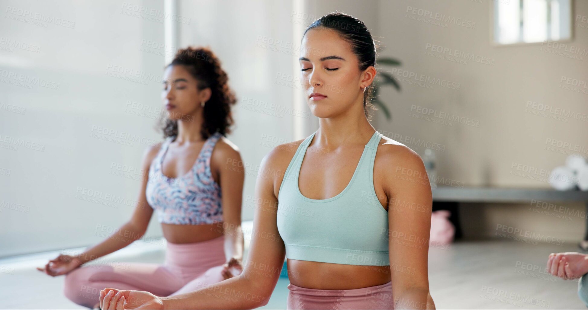 Buy stock photo Meditation, balance and class with women in studio for health, zen and spiritual wellness. Yoga, mindfulness and healing aura with people and holistic practice for relax, awareness or energy