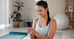 Yoga, happy and woman relax with phone for social media, online message and internet. Happy, pilates and person on smartphone for exercise, training and workout for wellness, health and progress