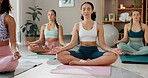 Meditation, yoga and lotus pose with women in class for mindfulness, health and wellness. Zen balance, spiritual and healing aura with people and holistic practice for relax, awareness or energy