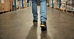 Person, legs and walking at warehouse for logistics distribution, courier service and package inventory. Worker, inspection steps and supply chain for shipping industry, quality assurance and storage