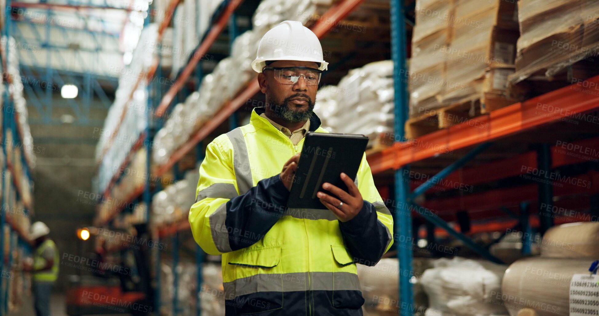 Buy stock photo Black man, helmet and tablet at warehouse for distribution industry, logistics checklist and package inventory. Worker, digital and inspection site of shipping order, supply chain and quality control