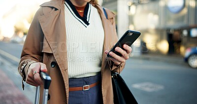 Buy stock photo Woman, phone and hands with luggage in street to travel with taxi app, transport and commute in city. Professional, person and smartphone for cab location, trip details and ride service on sidewalk