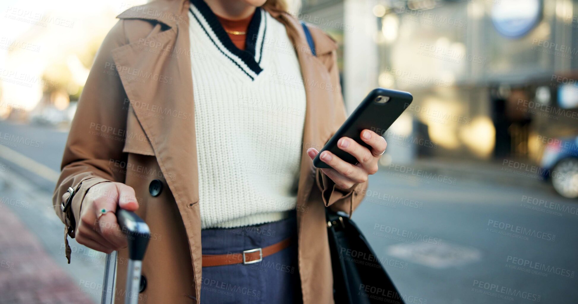 Buy stock photo Woman, phone and hands with luggage in street to travel with taxi app, transport and commute in city. Professional, person and smartphone for cab location, trip details and ride service on sidewalk