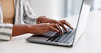 Woman, hands and laptop for article in office, professional journalist and typing column at desk. Female person, fingers and employee to report media at press agency, email feature and upload online