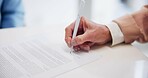 Documents, hand and pen for signature with business person closeup in office for agreement or contract. Desk, legal and writing with professional employee in workplace for compliance paperwork