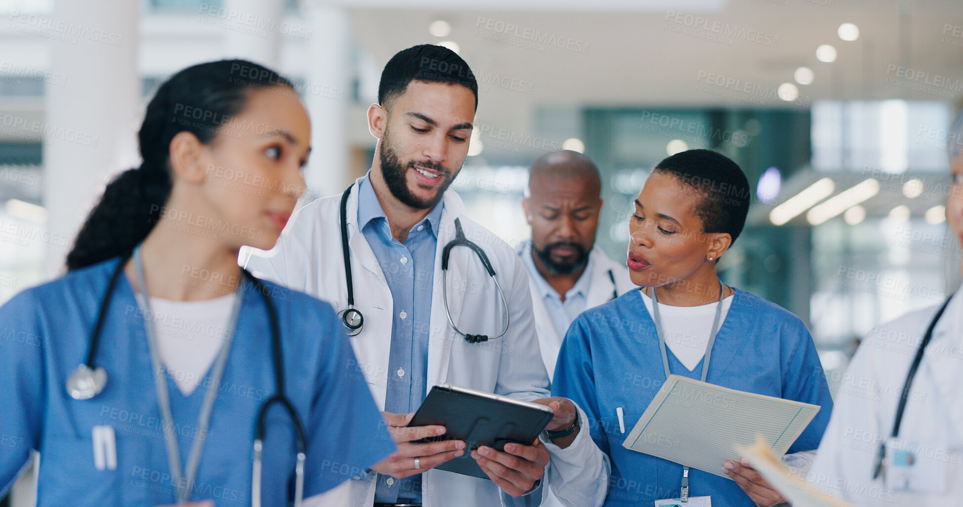 Buy stock photo Meeting, tablet and doctors walking in hospital for medical service, consulting and surgery schedule. Healthcare, diversity and men and women with digital tech, paperwork and documents for diagnosis