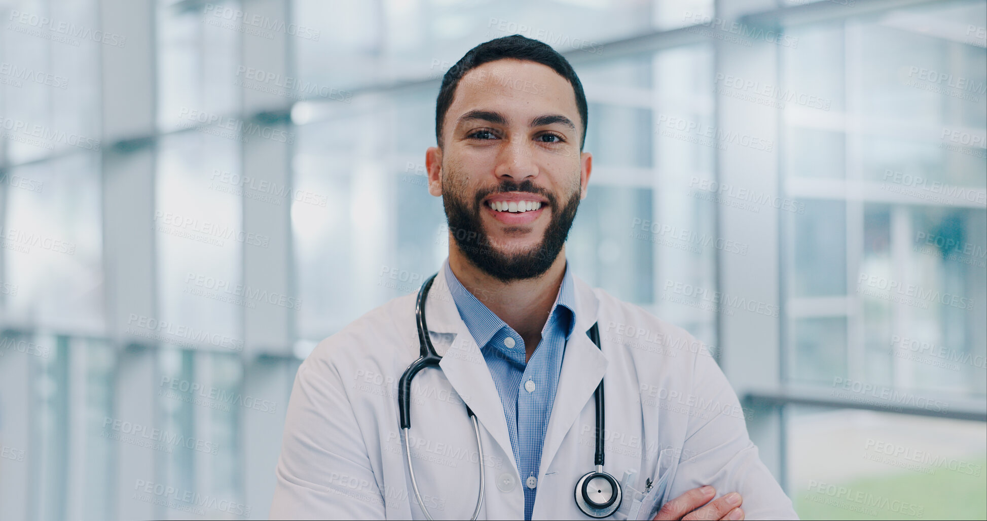 Buy stock photo Doctor, man and happy with arms crossed in portrait at hospital with pride for medical career. Person, smile and healthcare professional in corridor at clinic for wellness, services and job in Mexico