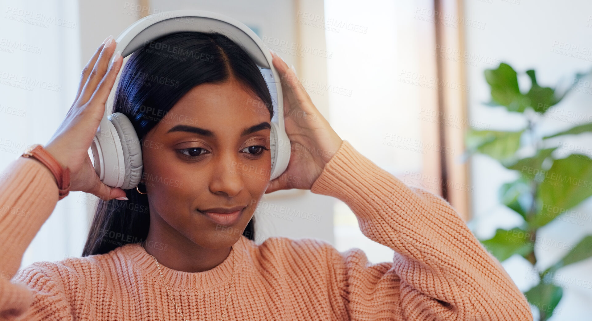Buy stock photo Woman, headphones and listening to music in home with thinking, reflection and sound with memory. Indian girl, person and hearing with inspiration, audio tech and streaming subscription at apartment
