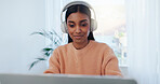 Education, laptop and music with Indian woman in home office for online study or remote work. Computer, learning and listening with happy freelancer in apartment for report, research or typing