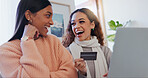 Laughing, online shopping and friends with card, home and bonding in living room, talking and discount. Ecommerce, women and payment with credit, digital and choice of purchase, laptop and lounge