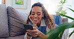 Girl, couch and phone with scroll in home for social media browsing, reading ebook and smile for text message. Indian woman, person and happy with smartphone on sofa for relax or comment on blog post