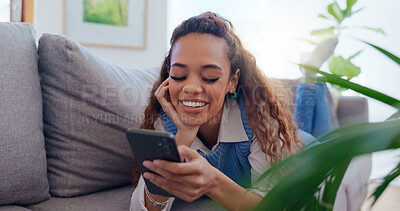 Buy stock photo Girl, couch and phone with scroll in home for social media browsing, reading ebook and smile for text message. Indian woman, person and happy with smartphone on sofa for relax or comment on blog post