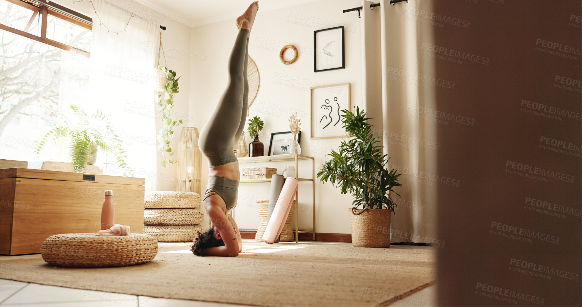 Buy stock photo Head stand, pilates and woman in home for exercise, chakra balance or health in morning routine. Wellness, fitness and female person with yoga workout for body strength in living room at apartment.