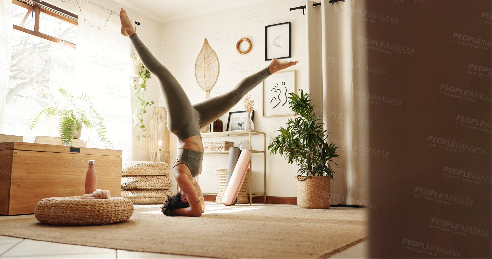 Buy stock photo Home, yoga and woman with balance, upside down and peace with chakra, morning routine and wellness. Apartment, healthy person and girl with pilates, stretching or fitness with exercise and calm