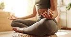 Woman, hands and yoga in home for fitness, peace and meditation in session on floor. Female person, lotus and pilates in living room for calm, healthy body and activity to improve cognitive wellbeing