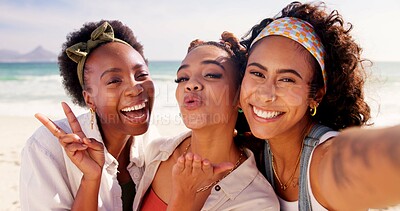 Buy stock photo Happy women, portrait and selfie with peace sign at beach for holiday or summer vacation together. Young, group or female people with smile, kiss or hug in joy for picture, memory or moment by ocean