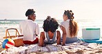 Friends, picnic and happy to relax on beach with conversation, summer holiday and bonding on blanket. Back, people and group with tropical adventure at ocean for fun vacation, reunion trip and break