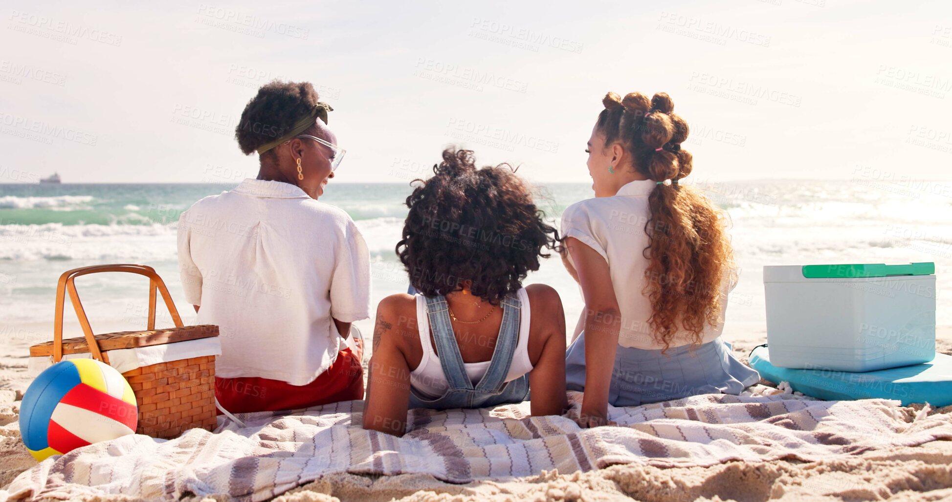Buy stock photo Friends, picnic and happy to relax on beach with conversation, summer holiday and bonding on blanket. Back, people and group with tropical adventure at ocean for fun vacation, reunion trip and break