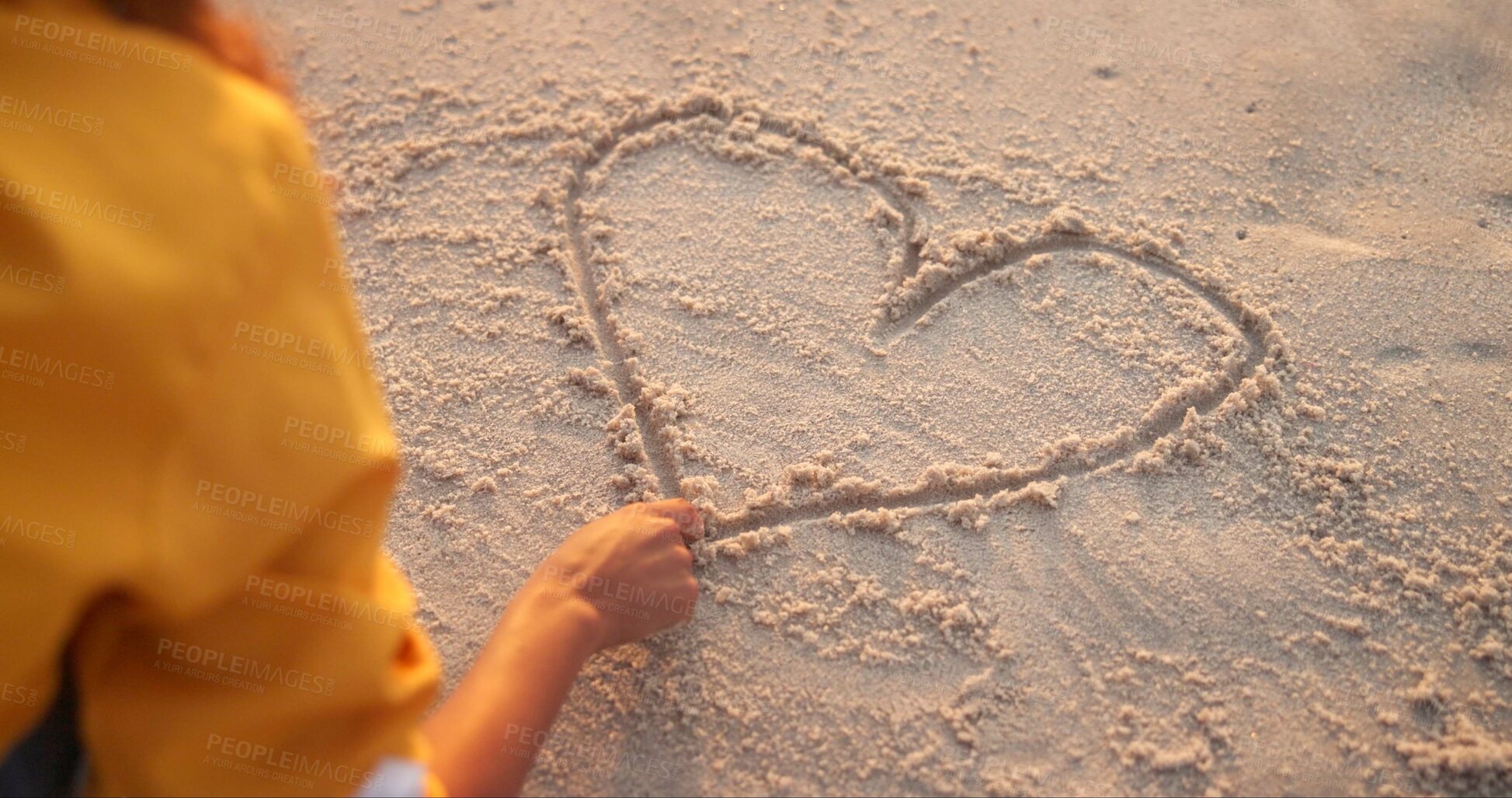 Buy stock photo Woman, hand and drawing heart in sand, outdoor peace and emoji for love on beach vacation. Female person, nature and symbol for romance on weekend trip, back and finger for support or care icon