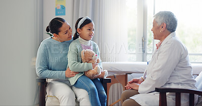 Buy stock photo Pediatrician, child and mom at hospital consultation with help of mature woman and teddy with health check. Smile, clinic and healthcare with exam, young girl and wellness with family doctor and talk