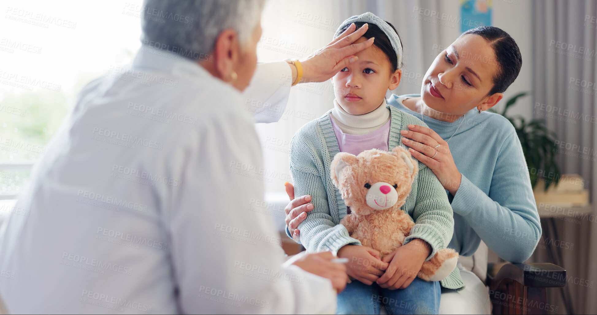 Buy stock photo Woman doctor, child and check fever at hospital, pediatrician and sick girl for assessment. Mature nurse, helping kid and touching head for physician examination, health and parent support at checkup