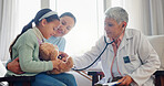 Hospital, stethoscope and doctor with child for consulting, medical service and help in clinic. Healthcare, pediatrician and woman with mom and girl for diagnosis, listening to breath and wellness