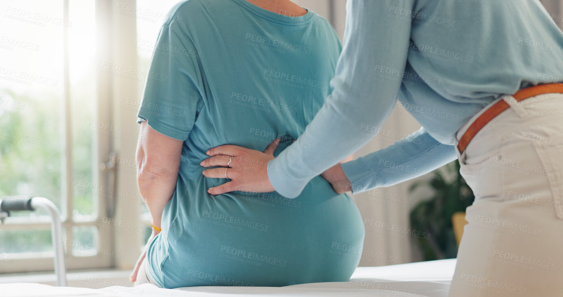 Buy stock photo Back pain, physiotherapy and hands of people in office for medical exam, support and injury recovery. Women, physiotherapist and patient with consultation for osteoporosis, rehabilitation or progress