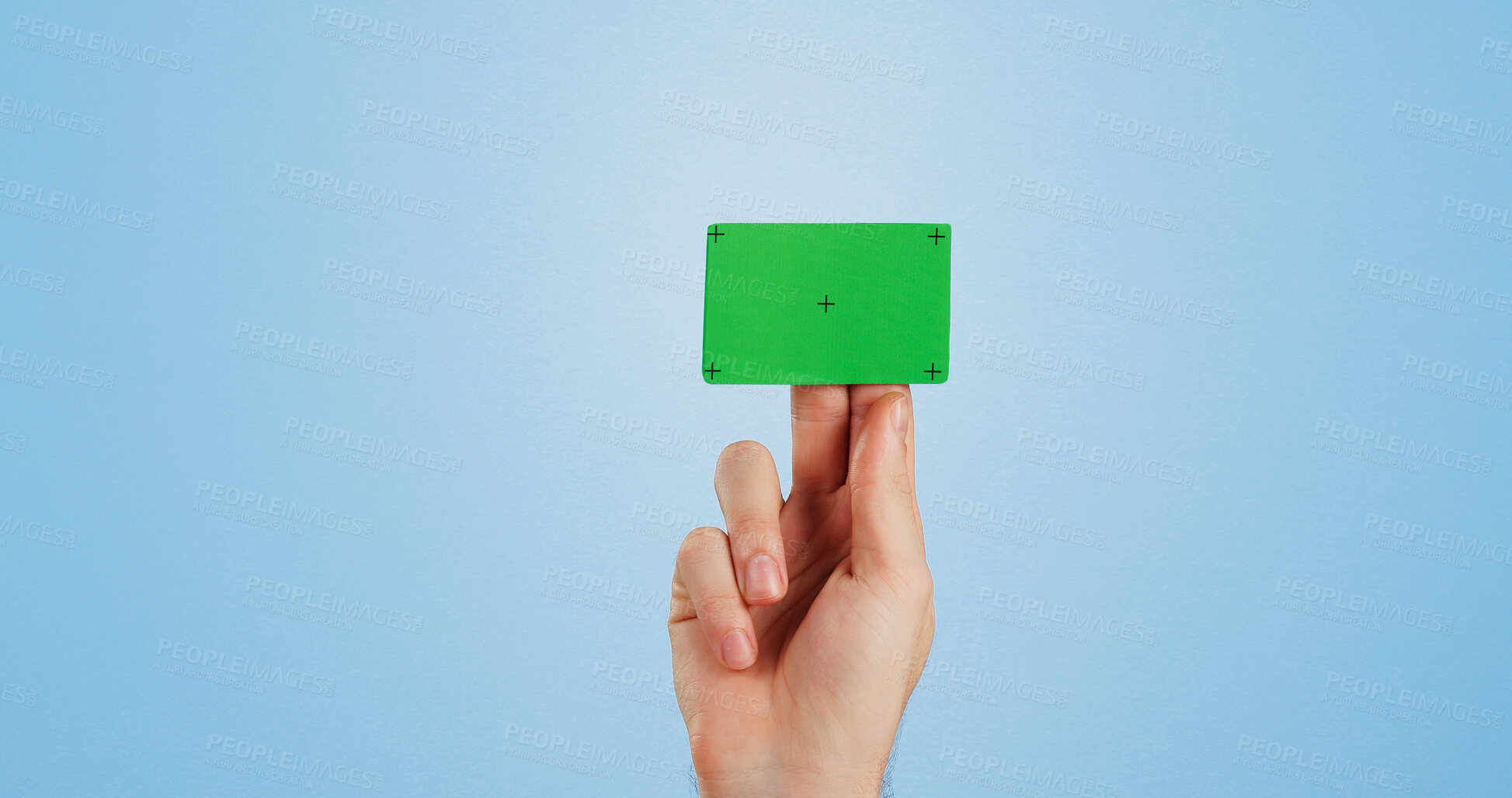 Buy stock photo Hand, green screen and business card in studio mockup for recruitment, offer and contact detail. Person, chroma key plastic and tracking markers on blue background space for banking, payment or promo