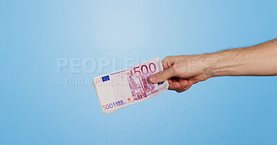 Buy stock photo Money, euro and hand of person in studio with offer, bonus or prize giveaway for financial freedom. Cash, budget and model with bills for profit, savings or salary increase on blue background space