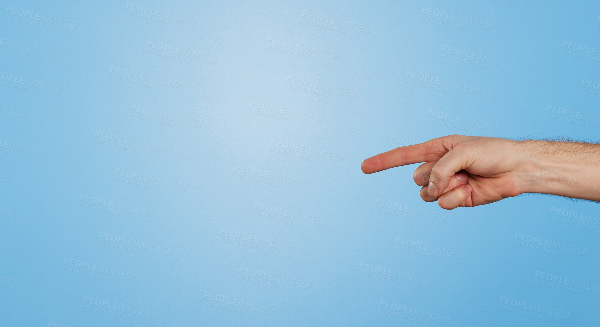 Buy stock photo Finger, point and arm of person in studio for information, direction and announcement of news. Hand, gesture and emoji by mockup space for review, answer and feedback of opinion on blue background