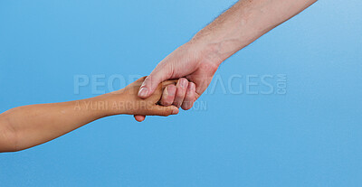 Buy stock photo People, arms and holding hands with support in studio for teamwork, connection and collaboration. Friends, love and emoji with gesture of unity for solidarity, care and kindness on blue background