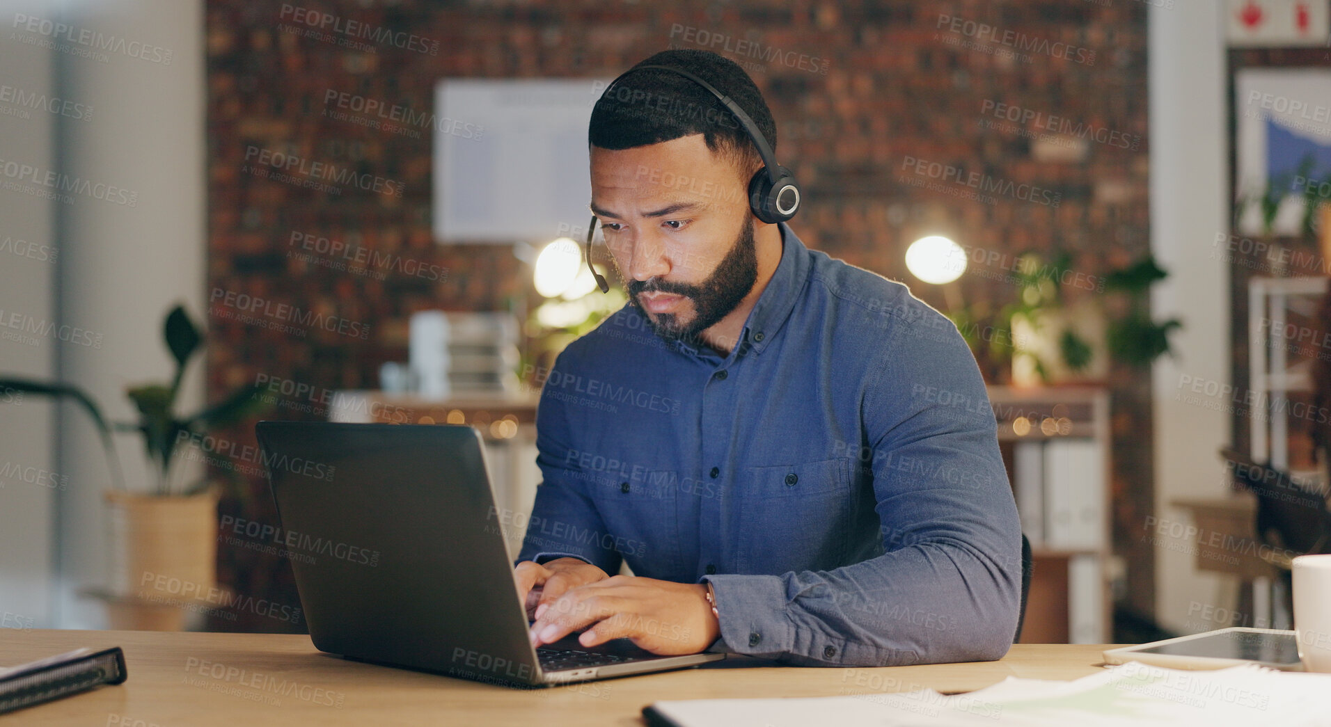 Buy stock photo Man, typing and headset in office for call center, contact us and customer service with sales. Agent, laptop and microphone in workplace for communication, lead generation or technical support