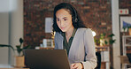 Callcenter, business woman and laptop in office at night with conversation, customer support and virtual assistant. Headphones, discussion and contact center agency with web consultation at desk